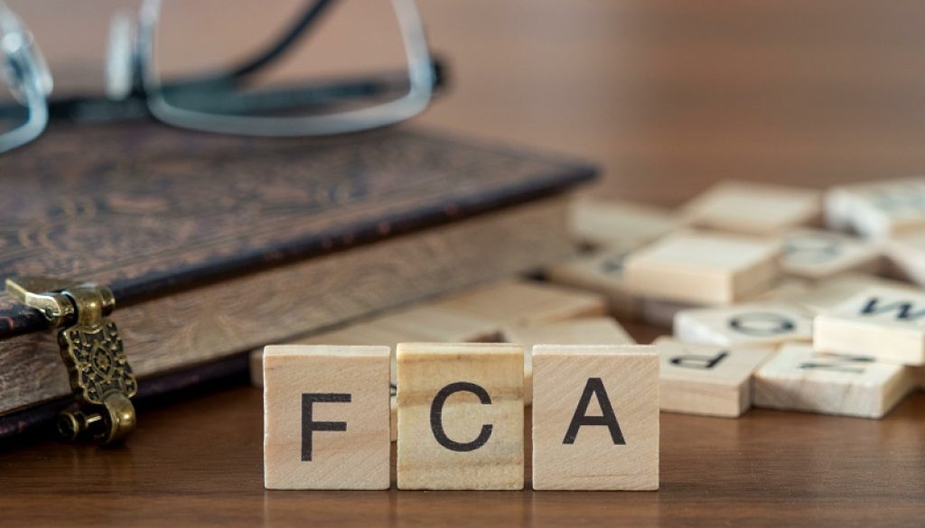 the acronym fca for Financial Conduct Authority concept represented by wooden letter tiles
