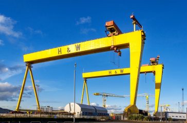 Belfast, Northern Ireland, UK - October 2, 2016: Samson and Goliath. Twin shipbuilding gantry cranes in Titanic quarter, famous landmark of Belfast, Norther Ireland. Goliath is in the foreground.