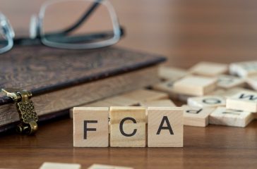 the acronym fca for Financial Conduct Authority concept represented by wooden letter tiles