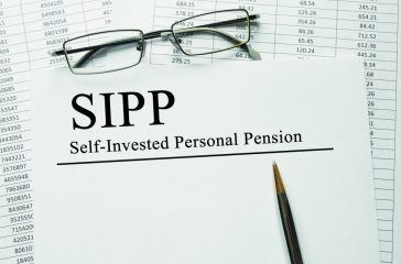Paper with Self-Invested Personal Pension (SIPP) on a table